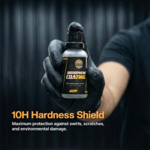 Extreme close-up of Borophone Coating in a 30ml bottle held by a person wearing black gloves, highlighting durability for motorbike protection.