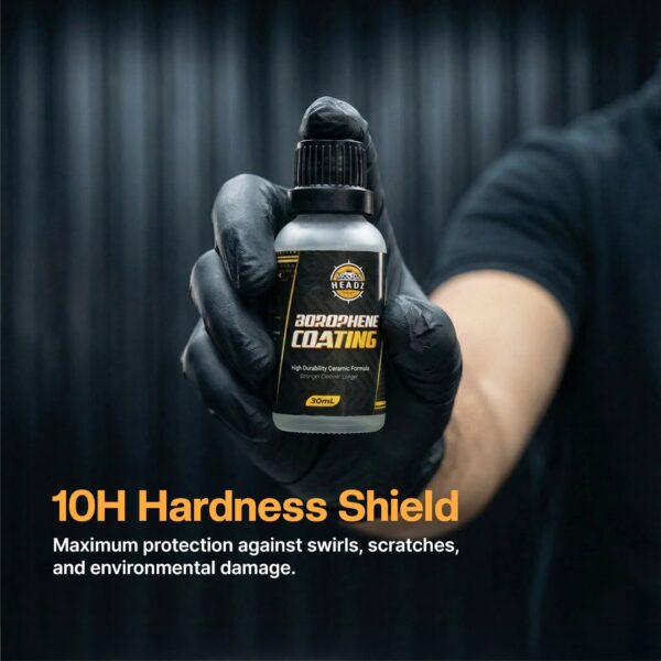 borophene-coating-Motor-Headz-00008 Extreme close-up of Borophone Coating in a 30ml bottle held by a person wearing black gloves, highlighting durability for motorbike protection.