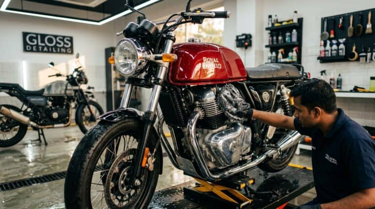 A clean motorcycle being washed carefully at home with soft tools and controlled water flow